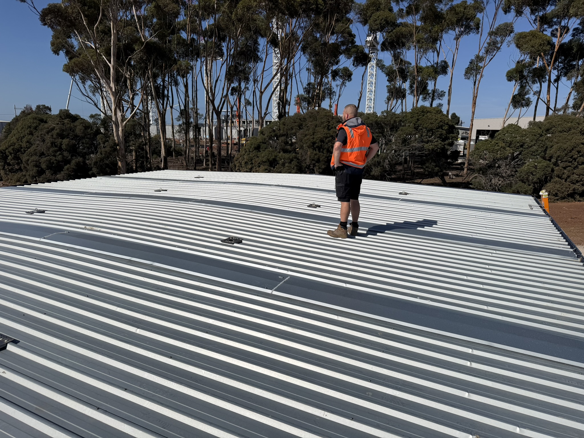 Melbourne WiFi technician on warehouse roof