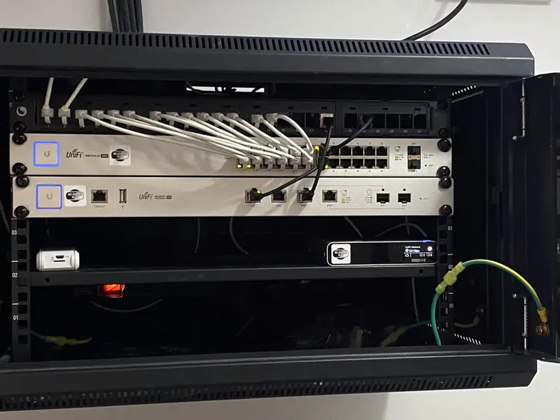 UniFi switches patched into a comms rack